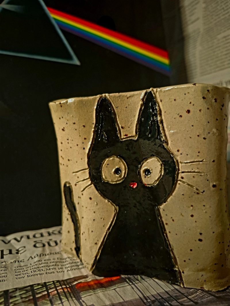 Jiji the cat in a ceramic cup