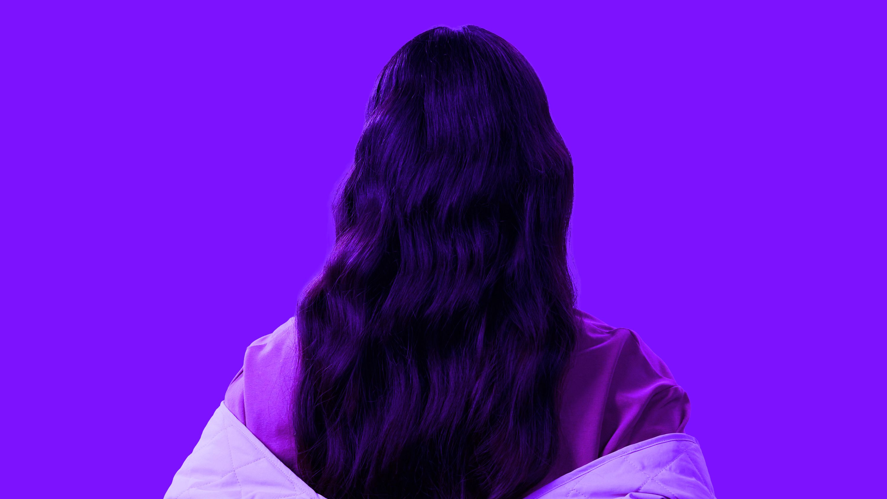 Person facing away on a purple background representing candidates not actively looking for roles