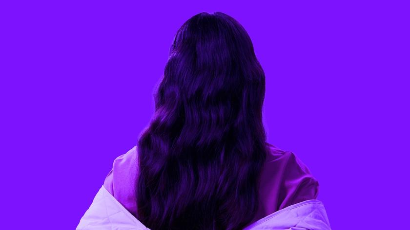 Person facing away on a purple background representing candidates not actively looking for roles
