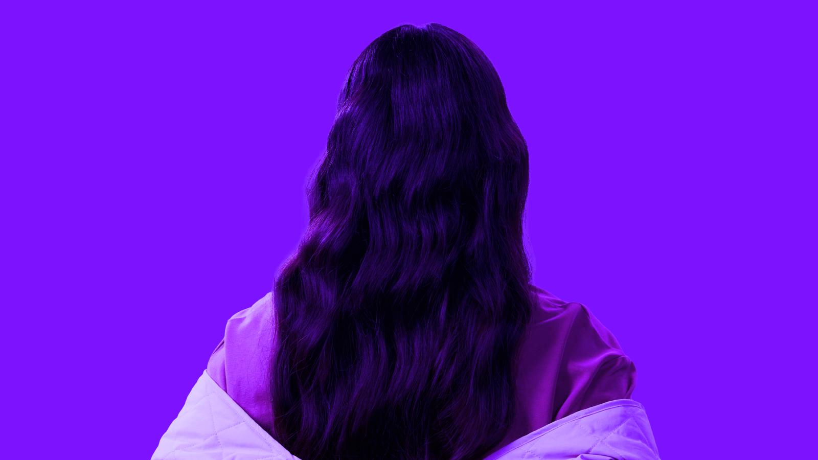 Person facing away on a purple background representing candidates not actively looking for roles