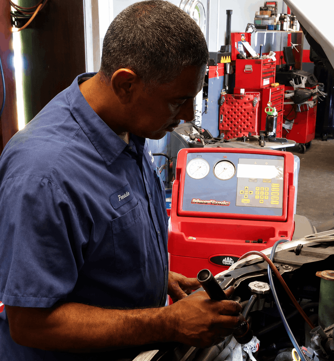 Reynoso Auto Repair, mechanic at work