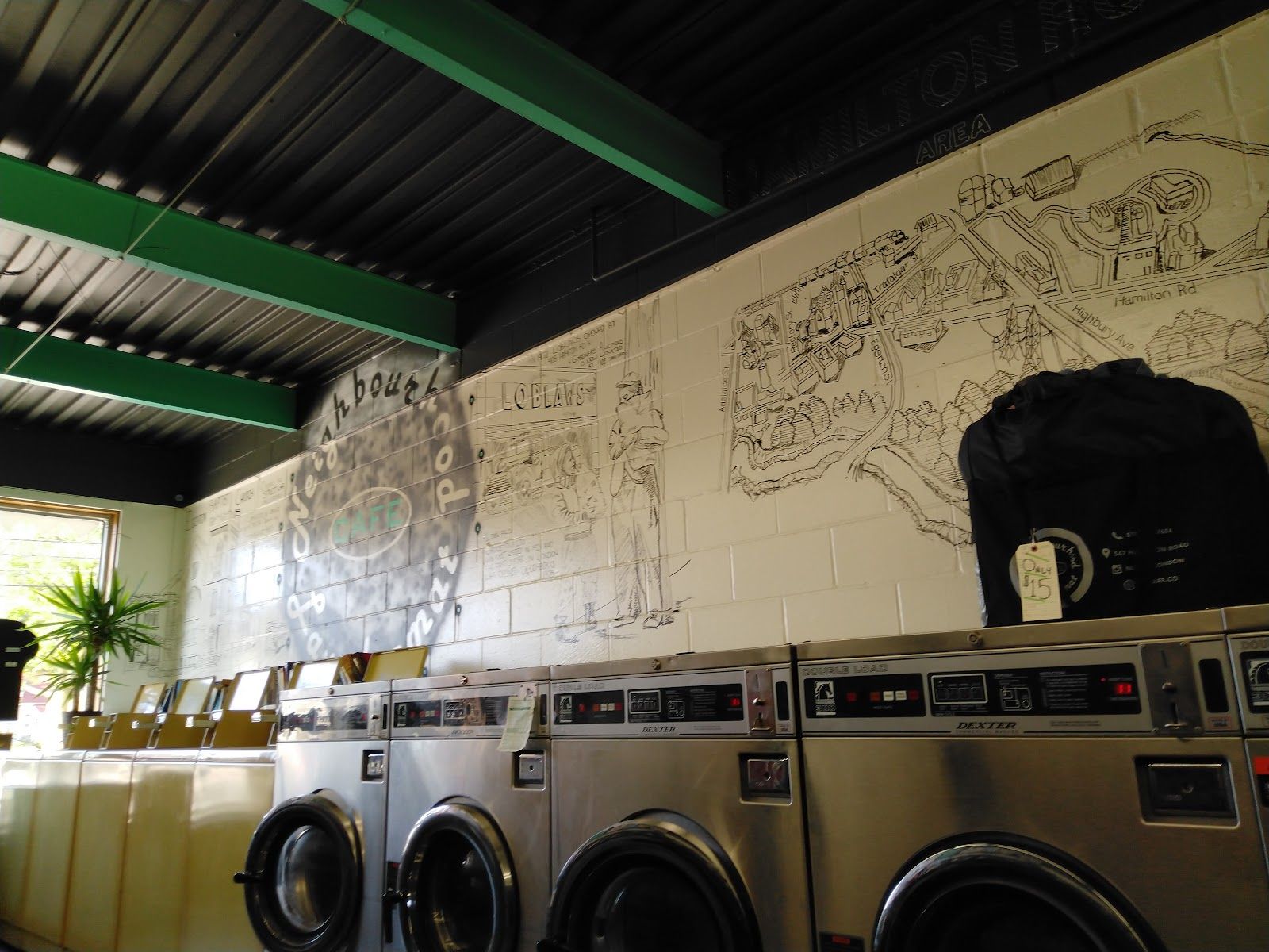 Neighbourhood Laundromat Cafe, mechanic at work