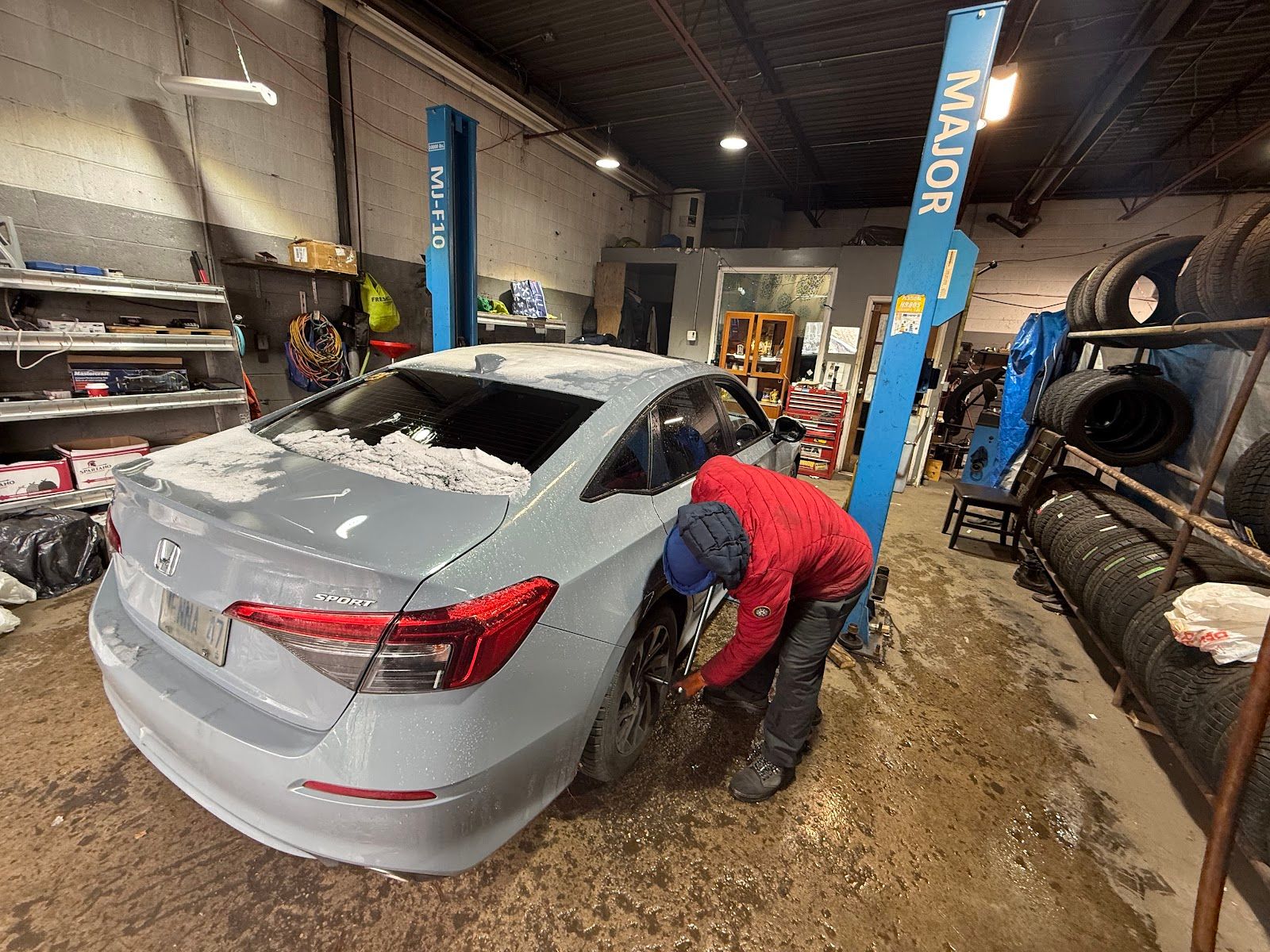 J & B Tires, mechanic at work