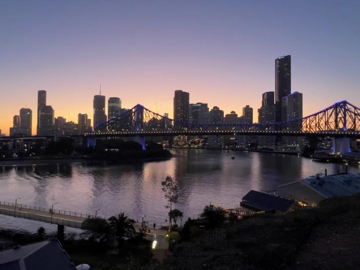 sunset with city skyline and bridge