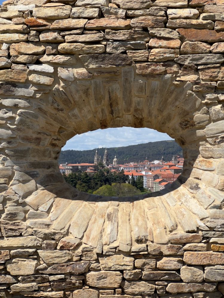 cathedral viewed through hole in wall