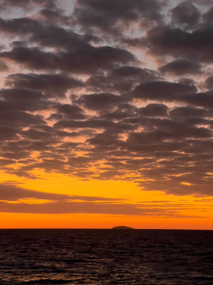 puffy clouds at sunset