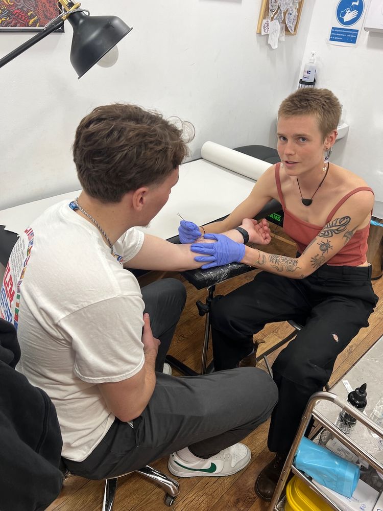 man getting tattoo