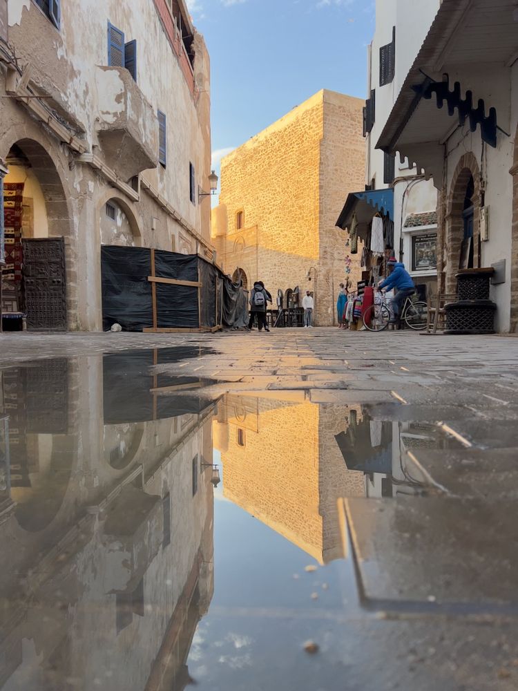 building reflection in street water