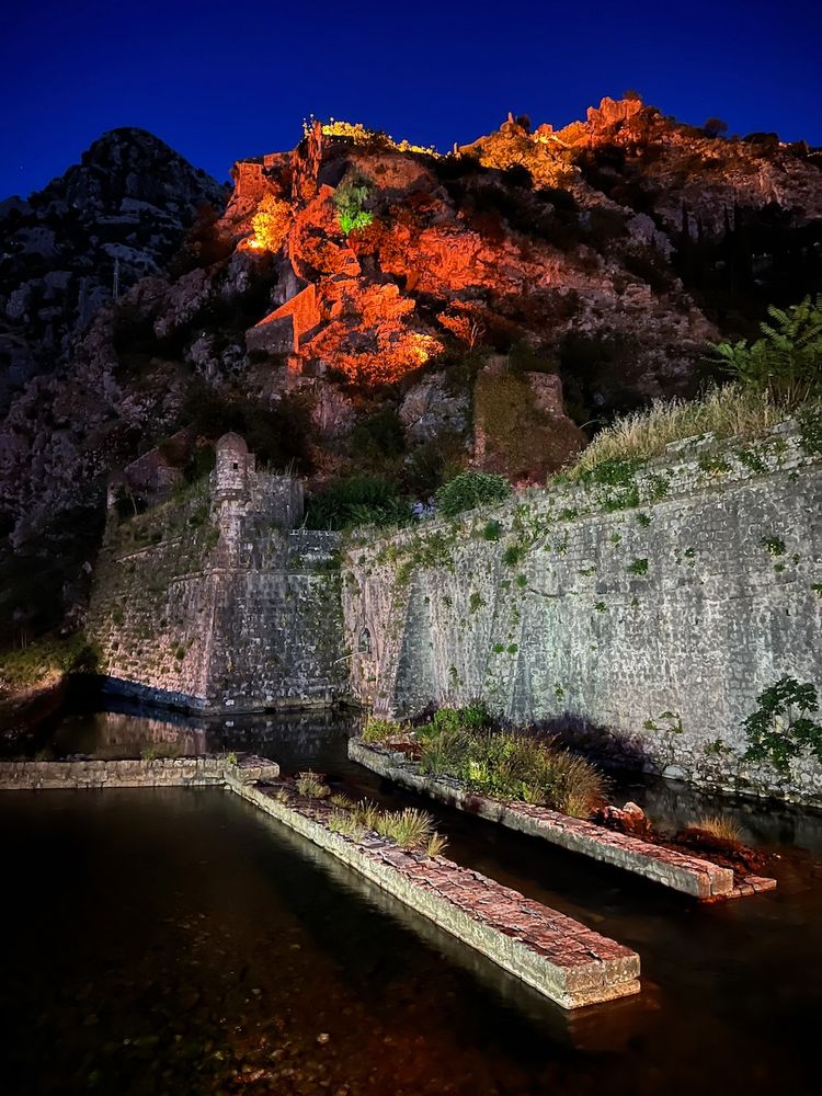 fortress walls lit up at night