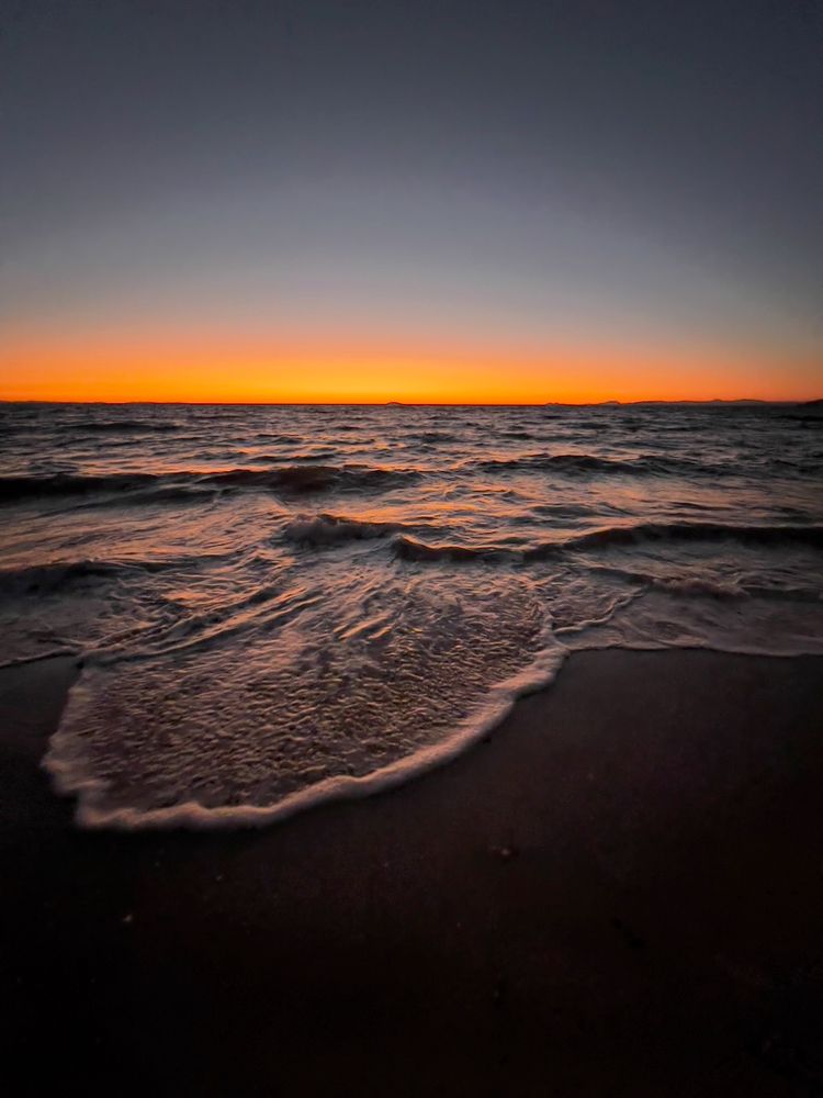 wave crashing at sunset