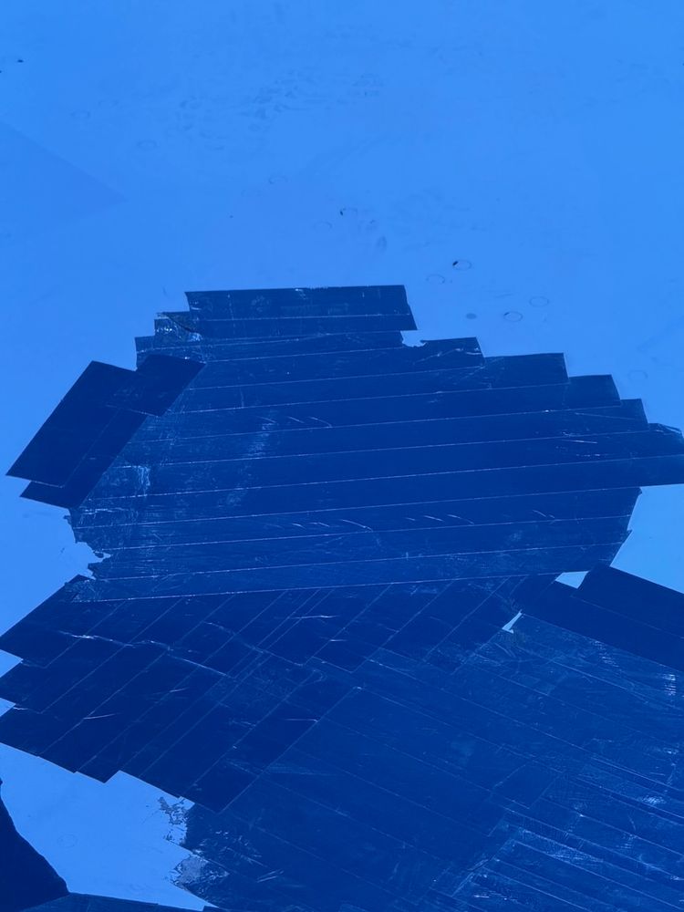 airplane wing with tape on it