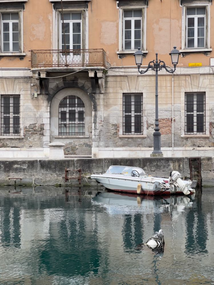 venetian building reflected in canal