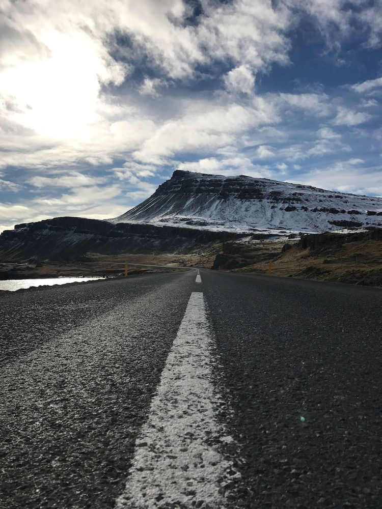 road with mountain in background