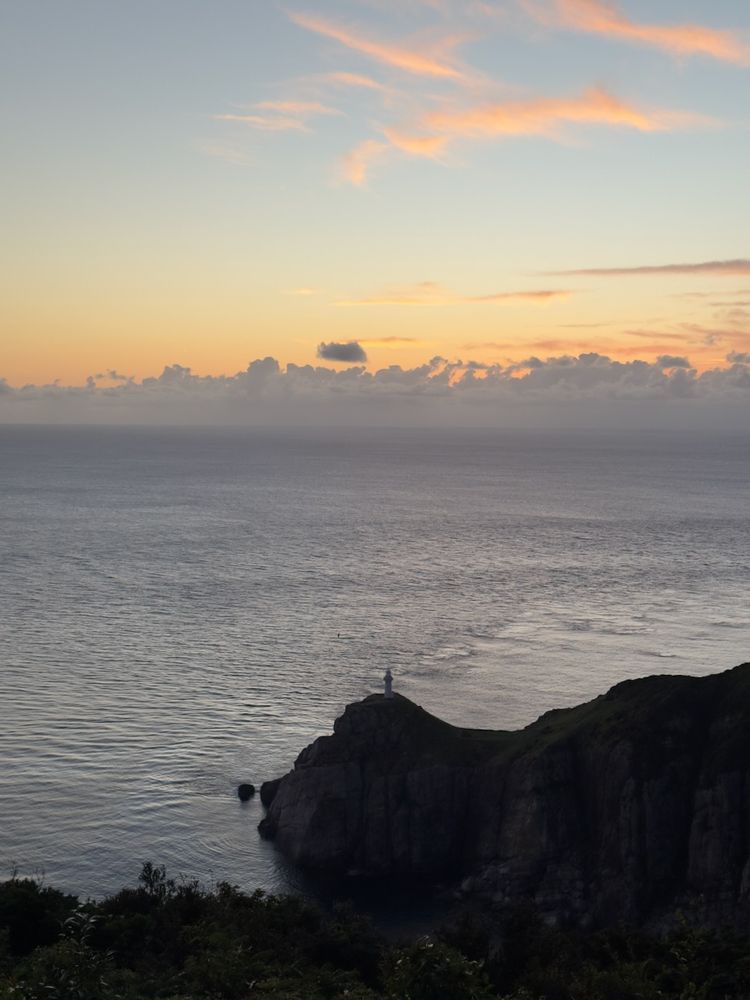 lighthouse silhouette at sunset