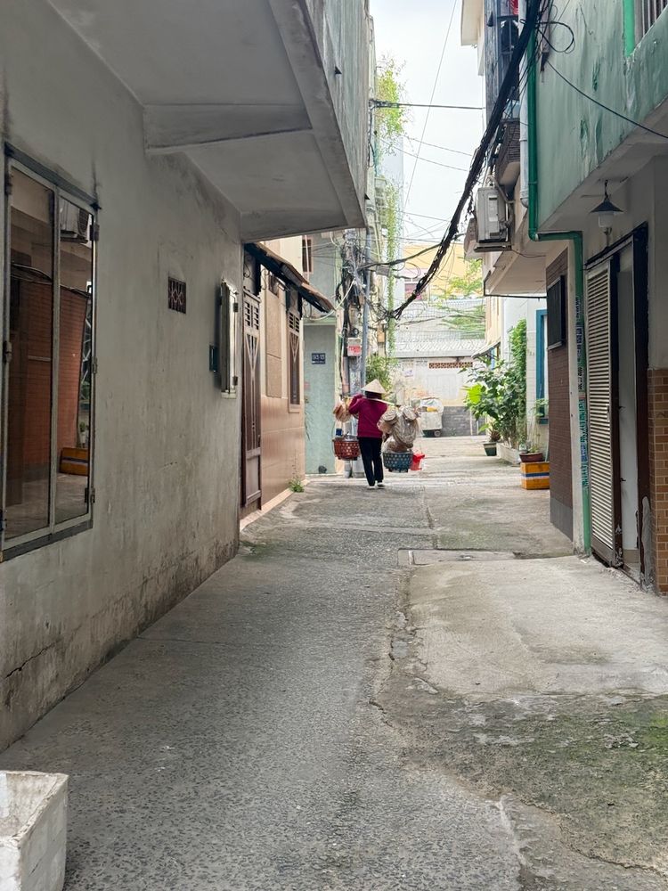 woman walking in alleyway