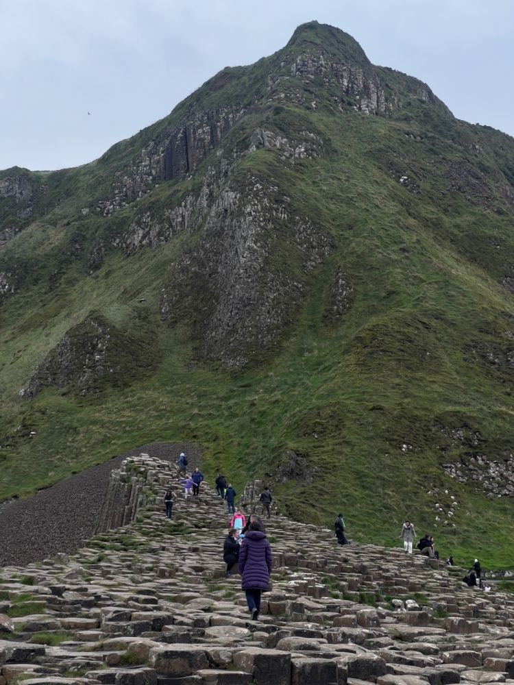 basalt rocks below mountain peak