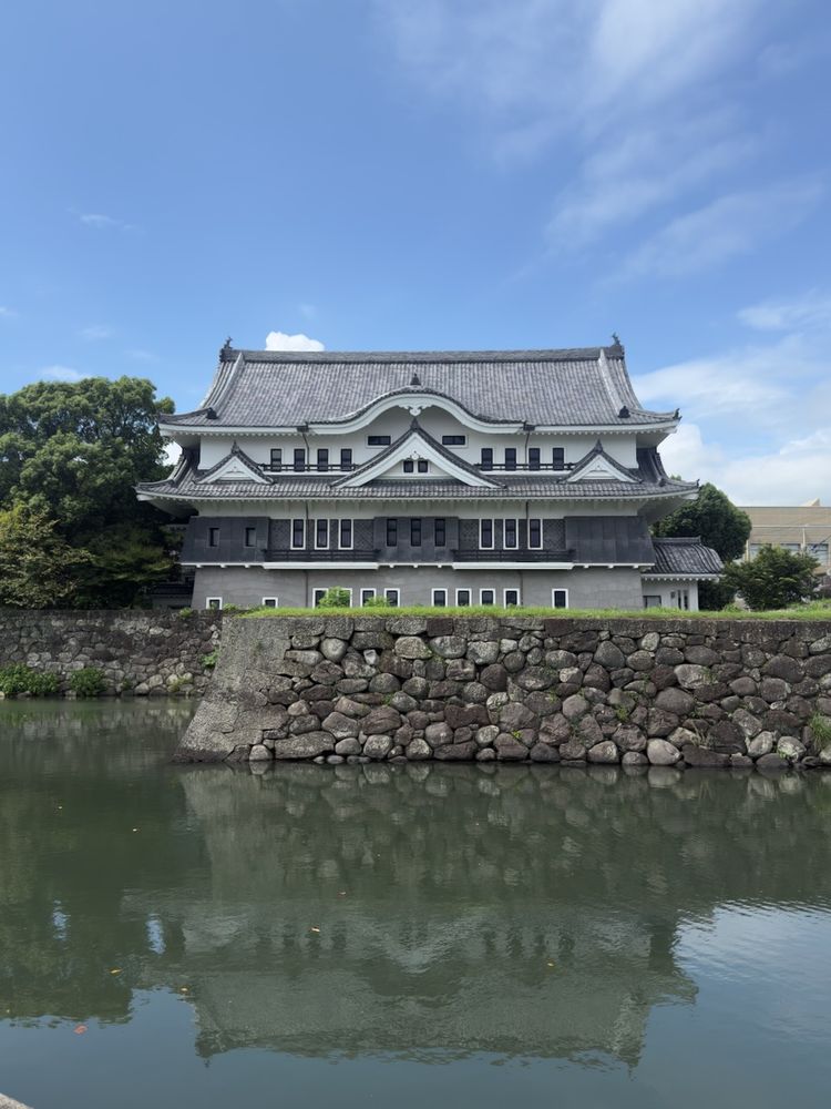 traditional japanese building reflecting in water