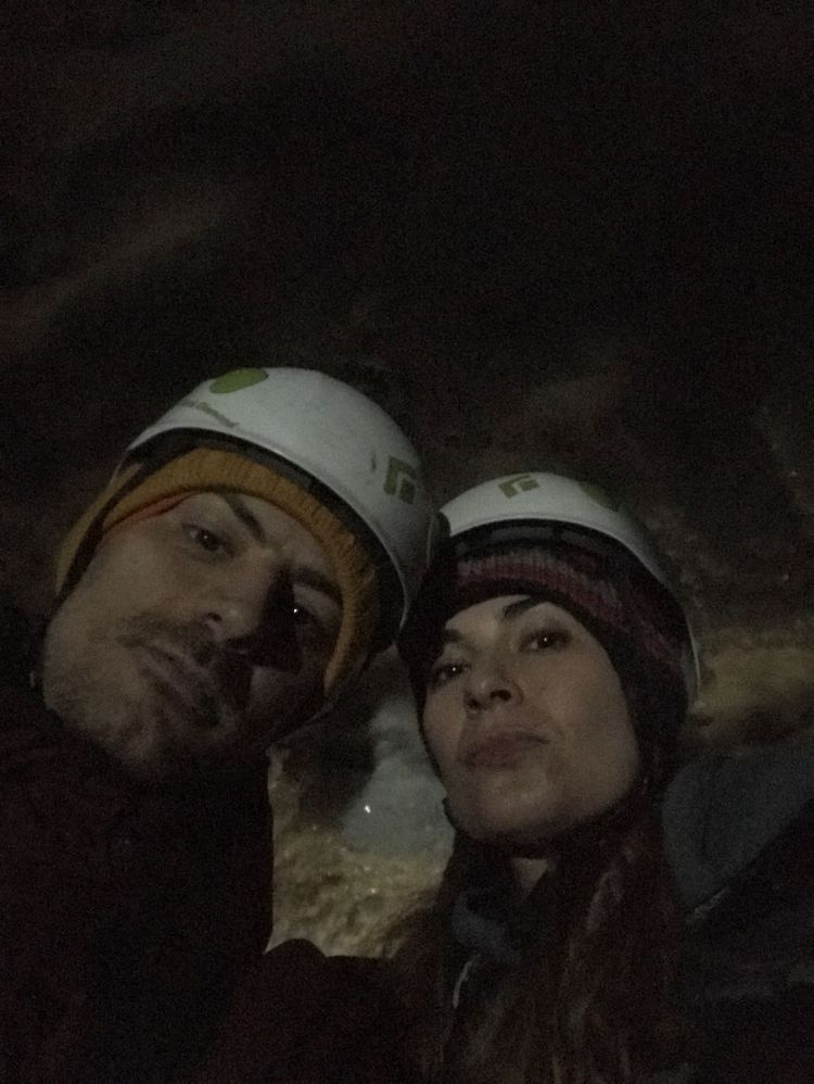 two people inside ice cave