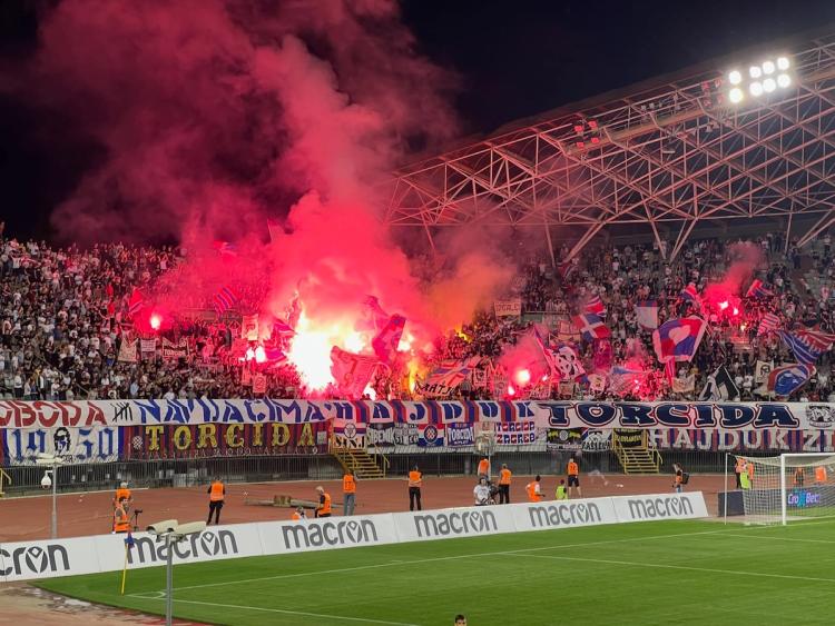 soccer supporters lighting flares