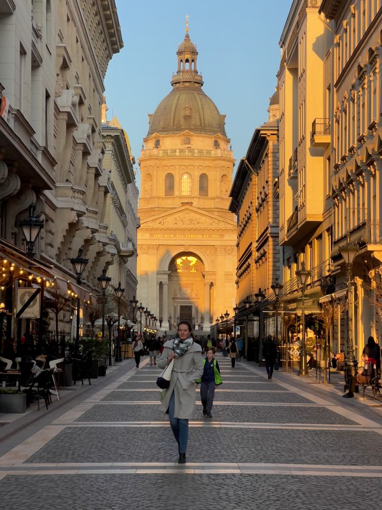 woman walking with cathedral in background