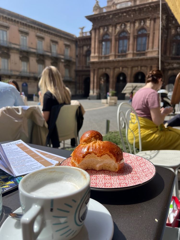 piazza with brioche and a cappuccino