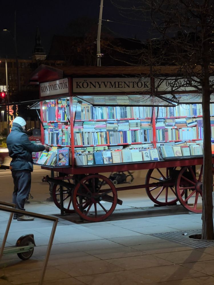 book seller on the street at night