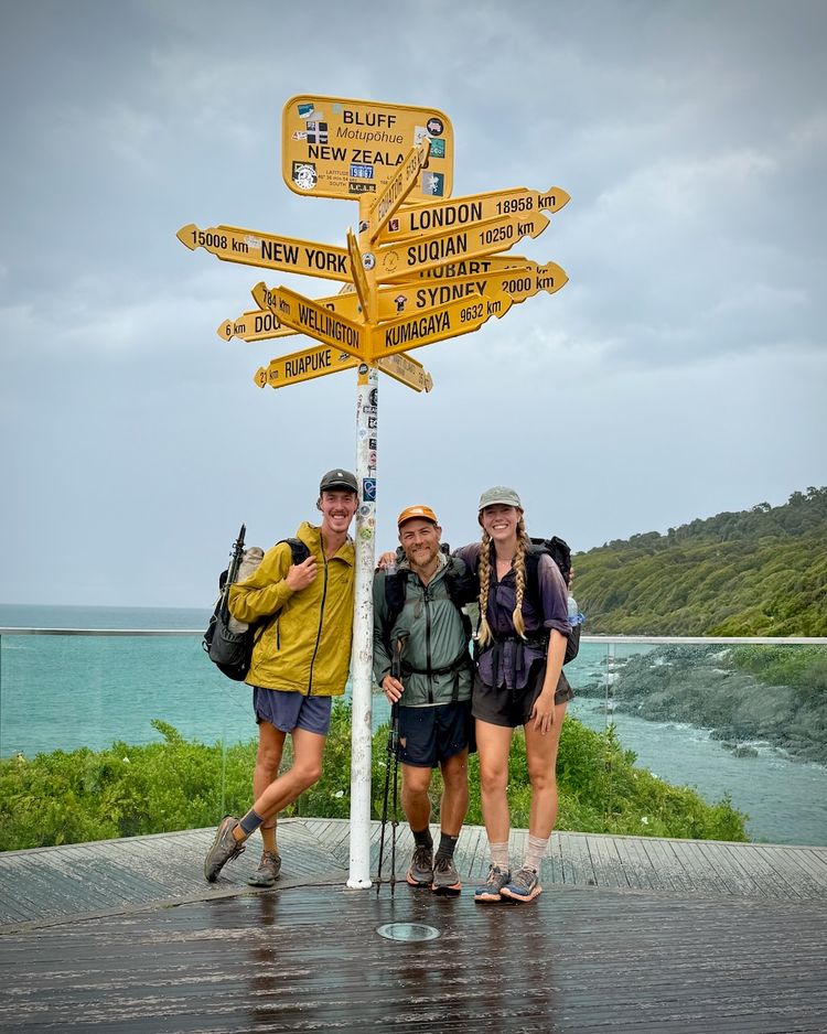 three hikers posing at end of hike