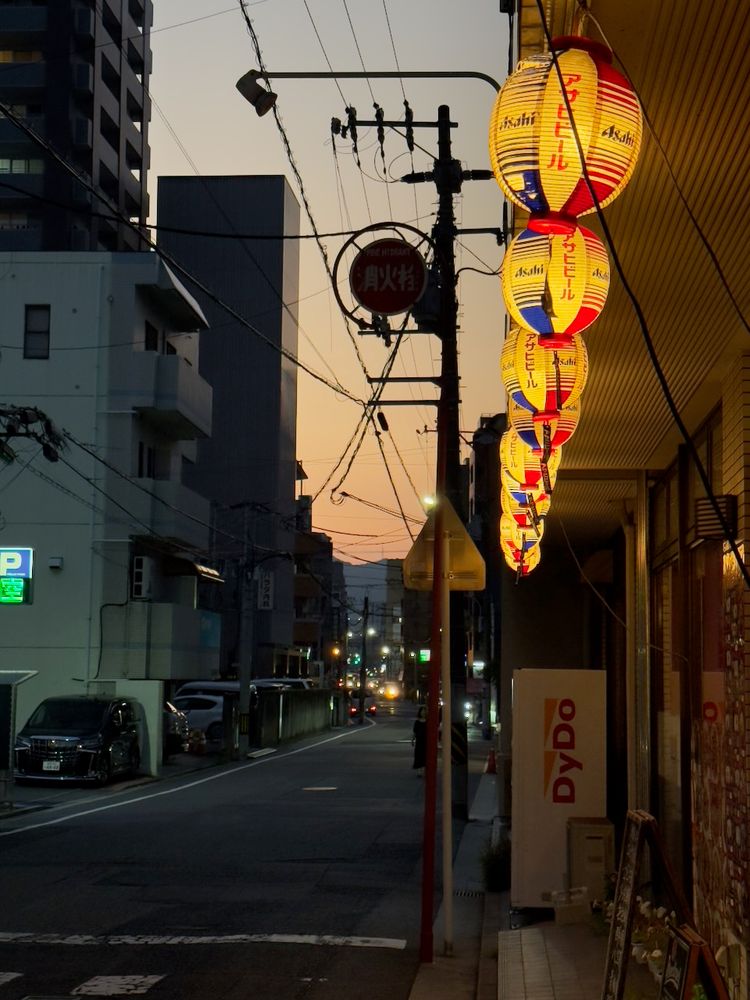 lit street lanterns at sunset
