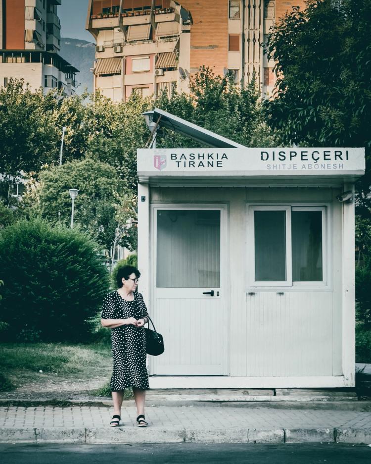 woman standing at bus stop