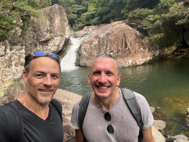 group selfie at small waterfall