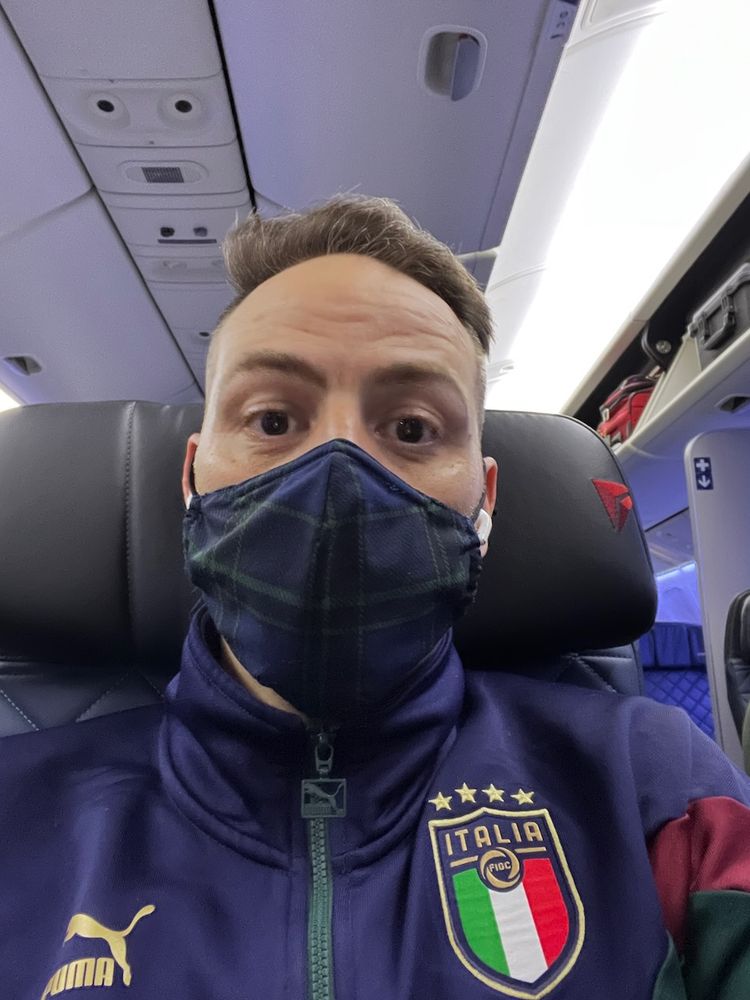 man wear mask on airplane