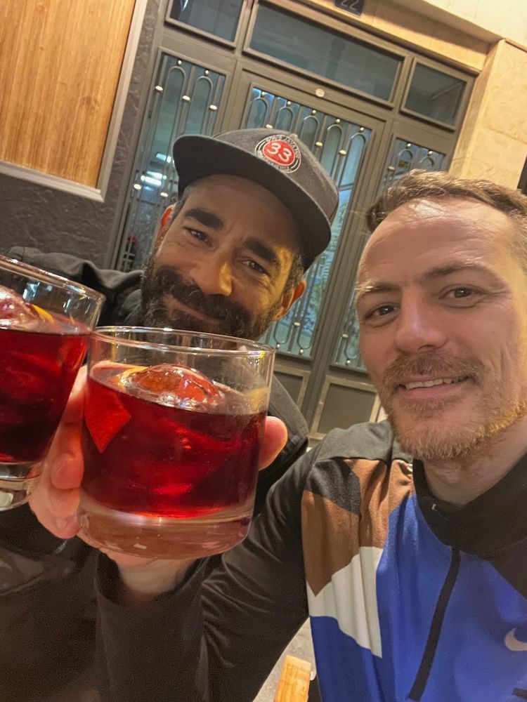 friends sharing a negroni