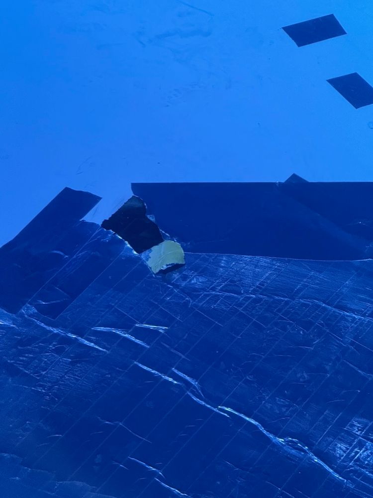 airplane wing with tape on it