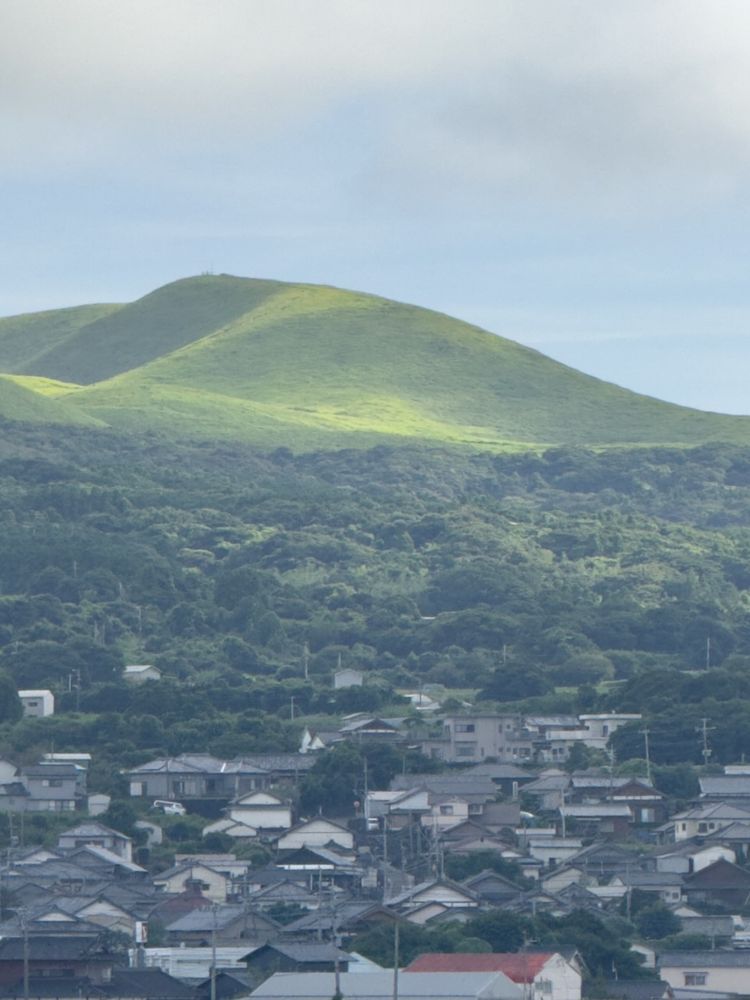 dormant volcano behind small town