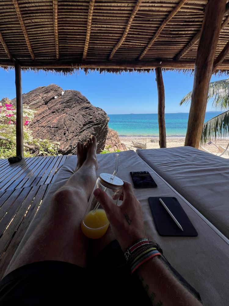 man enjoying ocean view from terrace