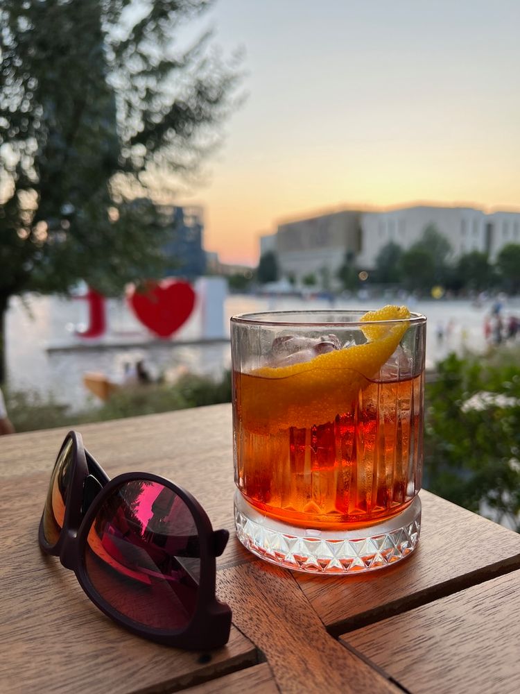 cocktail with sunset in background