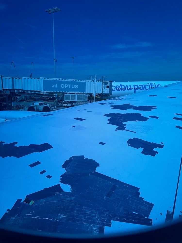 airplane wing with tape on it