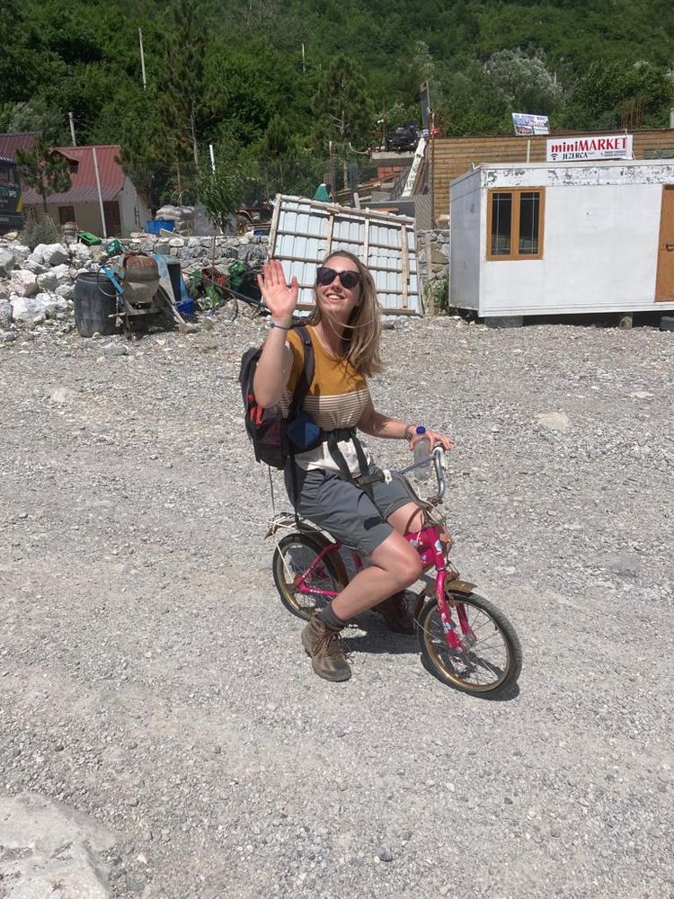 woman on child's bike
