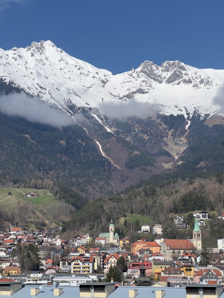 cityscape below mountains