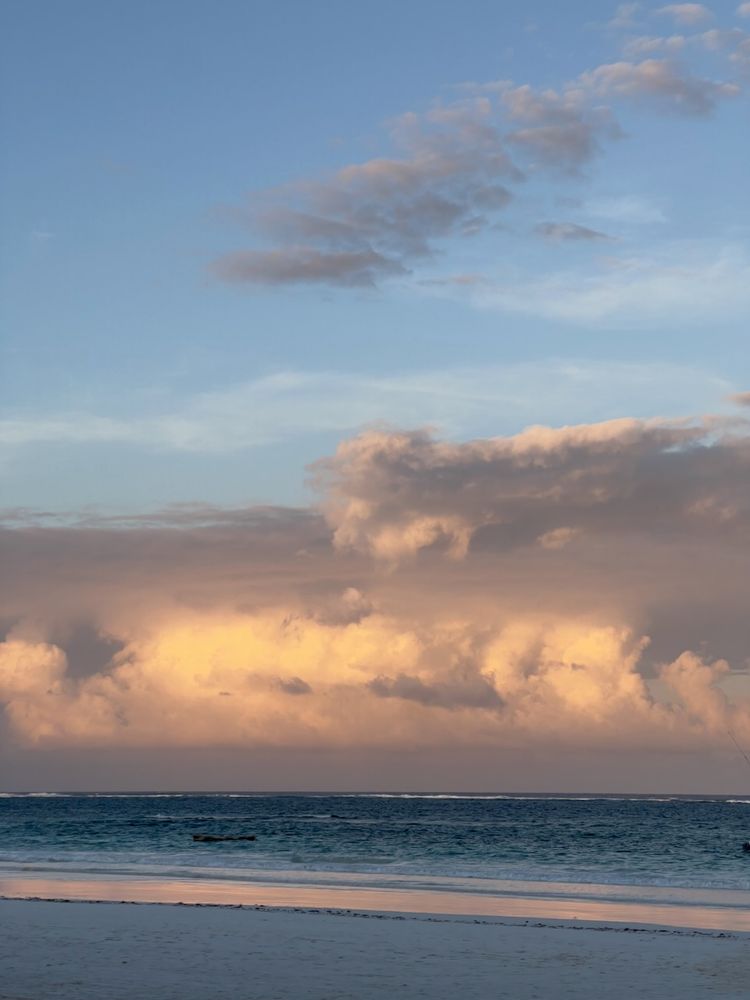 beach sunset with storm clouds in distance