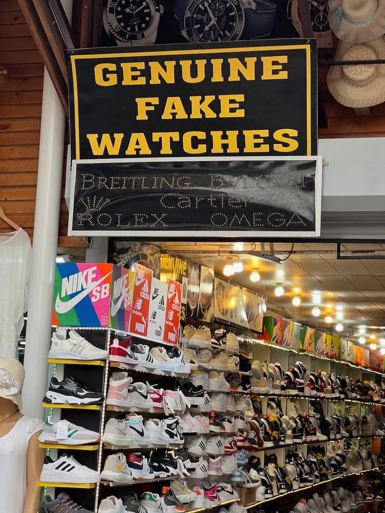 funny sign saying genuine fake watches