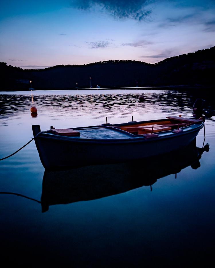 small boat at dusk