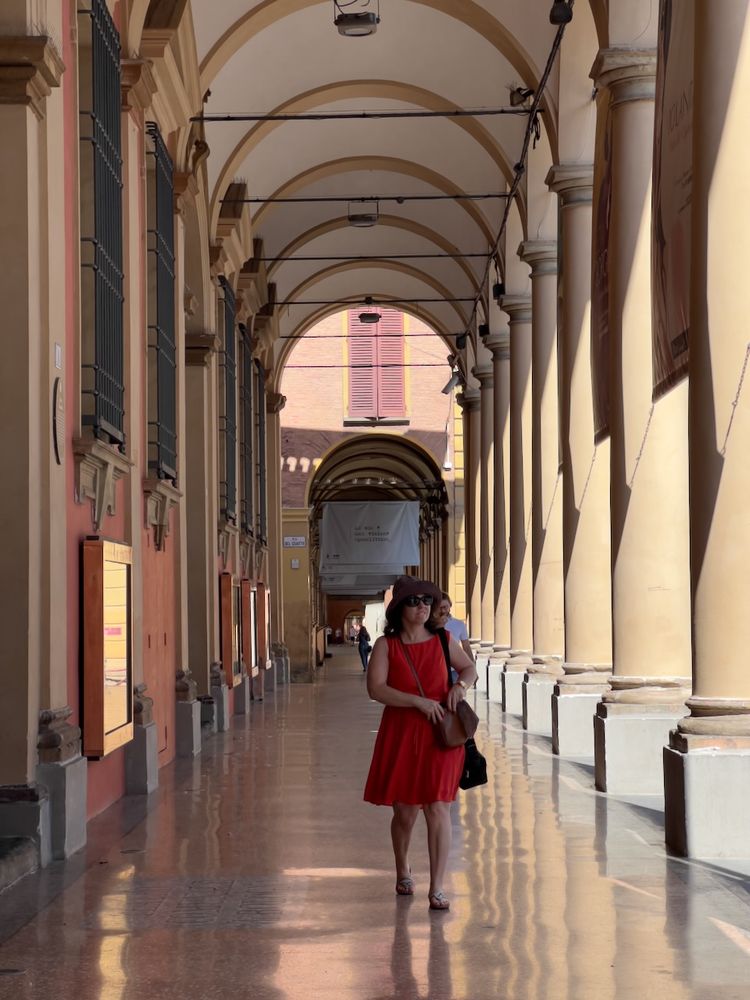 woman walking under portico