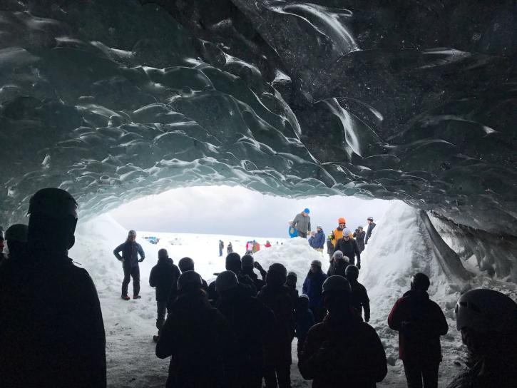 crowd of people in ice cave in iceland