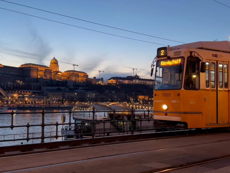 passing tram near river