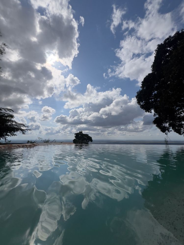 clouds reflecting in infinity pool