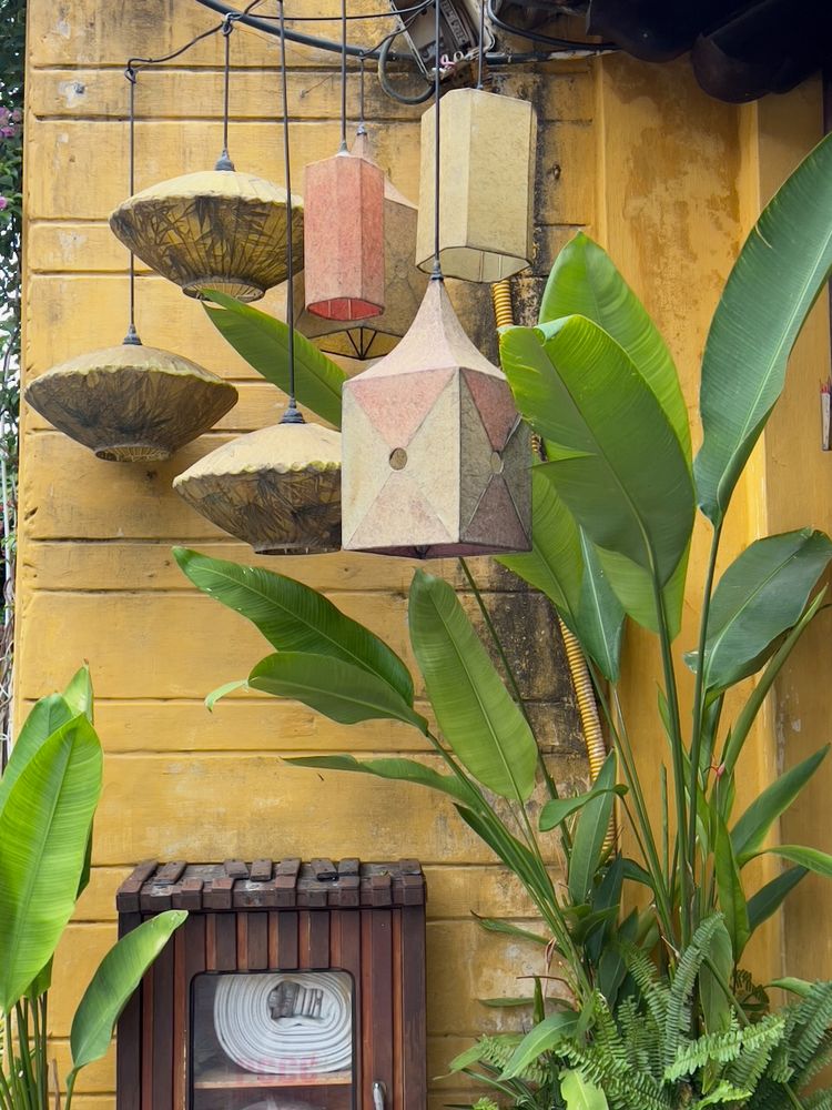 lanterns against yellow wall