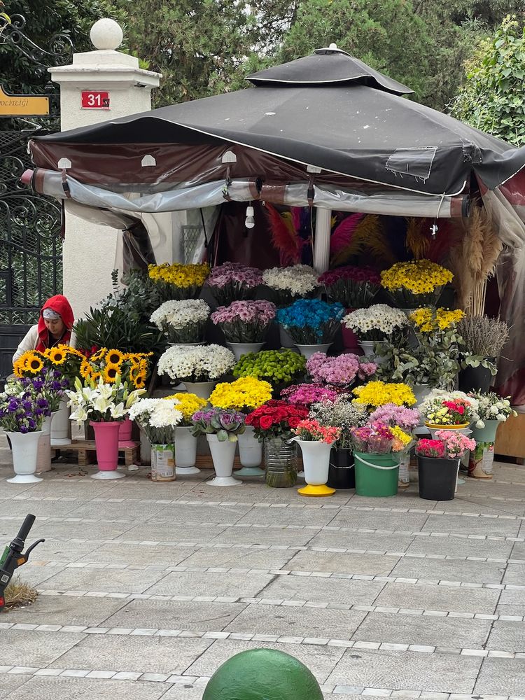 woman selling flowers on street