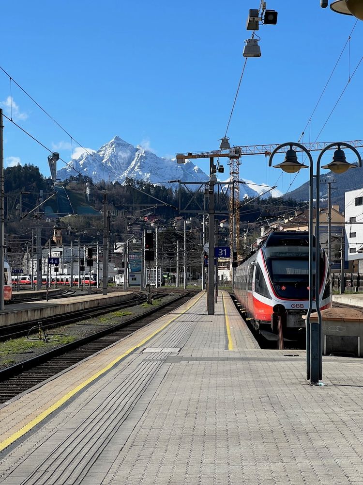 train in front of mountains