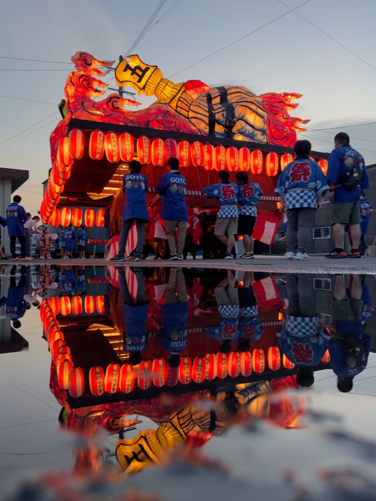 brightly lit float reflected in water